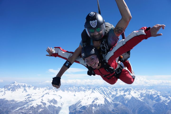 a person riding a snow board in the air